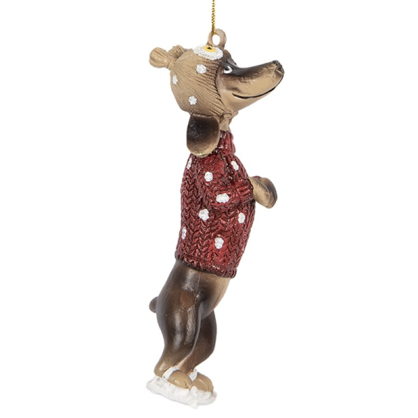 Dackelanhänger auf Schlittschuh mit rotem Pullover